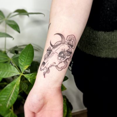Get a unique skull tattoo with intricate dotwork and fine lines, beautifully done by talented artist Michelle Harrison.