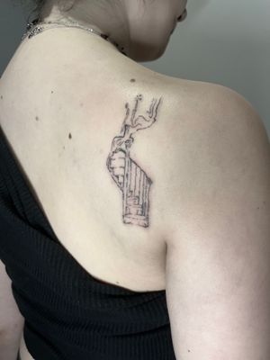 Illustrative tattoo featuring a stunning stairway design by Emily Bonnet.