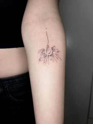 Elegant tattoo by Emily Bonnet combining fine lines and illustrative style to create a light motif.
