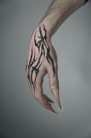 Intricate blackwork design combining tribal and cyber sigil motifs. Created by tattoo artist Dominga Longo.