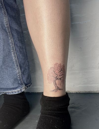 Embrace nature with this intricate and elegant illustrative tree tattoo crafted by the talented artist Emily Bonnet.