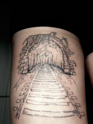 Discover the beauty of architecture with this stunning train tunnel design by Emily Bonnet. A masterpiece waiting to adorn your skin