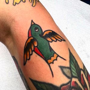 Get a classic and timeless traditional swallow tattoo done by the talented artist Alessandro Lanzafame. Perfect for those looking for a bold and eye-catching design.