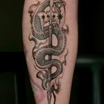 Dive into the world of neo-traditional tattoos with this stunning snake and halberd design by Kat Jennings.