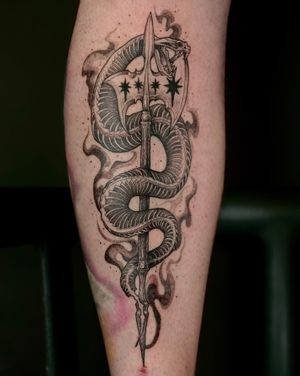 Dive into the world of neo-traditional tattoos with this stunning snake and halberd design by Kat Jennings.