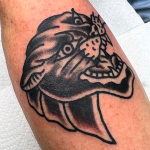 Get a fierce and bold traditional panther tattoo by talented artist Alessandro Lanzafame. Perfect for those seeking a classic look with a touch of wildness.