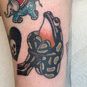 Get a classic yet unique frog design with this traditional style tattoo by the talented artist Jakob Isaac.