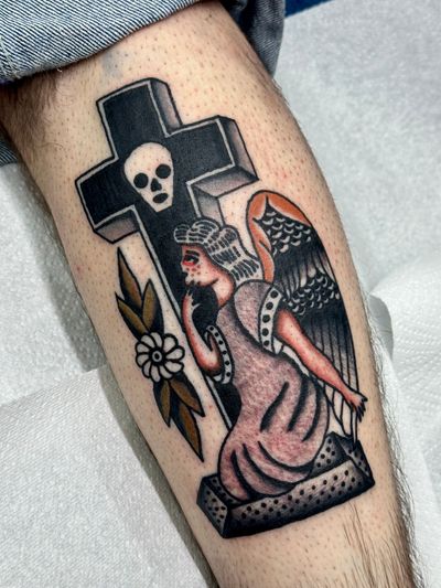 Stunning traditional tattoo featuring a reaper, cross, and angel, created by the talented artist Jakob Isaac.