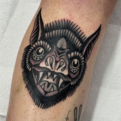 Get a timeless traditional bat tattoo done by the talented artist Jakob Isaac. Perfect for lovers of classic tattoo designs.