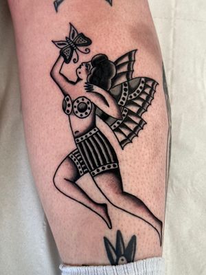 Get inked with a stunning woman pin-up fairy design by the talented Jakob Isaac. Perfect blend of classic and fantasy styles.