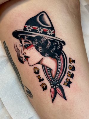 Capture the fierce spirit of the Wild West with this stunning traditional tattoo of a cowgirl lady by talented artist Jakob Isaac.