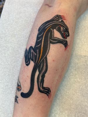 Get a timeless traditional panther tattoo by the skilled artist Jakob Isaac. Perfect for bold statement and fierce style.