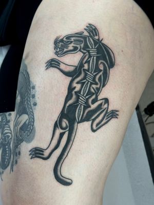 Get a fierce and timeless panther tattoo done in the traditional style by the talented artist Jakob Isaac.