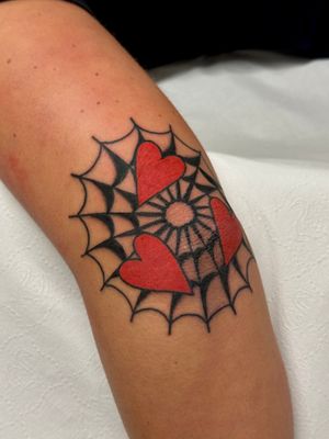 Get inked with a classic heart and spiderweb design by the talented artist Jakob Isaac. Perfect for those who love traditional tattoos.