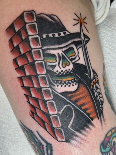 Capture the dark beauty of death with this traditional style tattoo of the menacing Grim Reaper by talented artist Jakob Isaac.