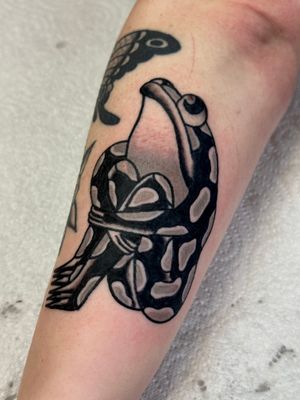Get a timeless design with this traditional style frog tattoo by the talented artist Jakob Isaac. Perfect for nature lovers and fans of classic tattoo art.