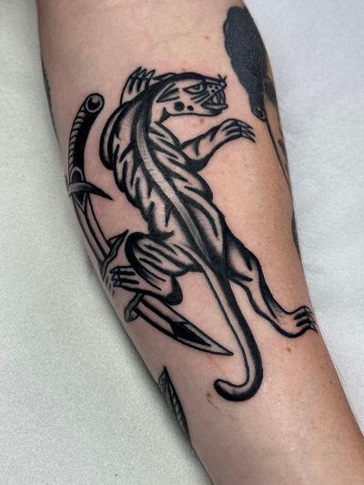 Get inked with this fierce traditional panther design crafted by the talented artist Jakob Isaac. Perfect for those seeking a bold and timeless tattoo.