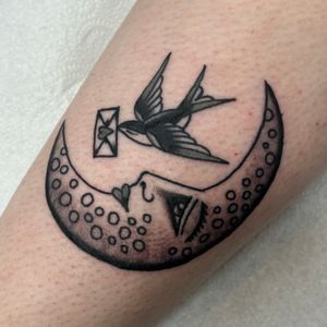 Get a classic traditional tattoo featuring a moon and swallow design by the talented artist Jakob Isaac.