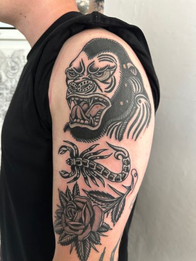 Check out this striking traditional tattoo featuring a scorpion, gorilla, and rose, beautifully executed by Jakob Isaac!