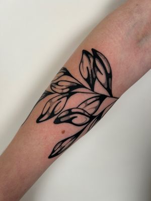 Capture the beauty of nature with this detailed illustrative branch tattoo by the talented artist Jack Howard.