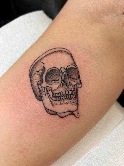 Experience the unique artistry of Jack Howard with this abstract dotwork skull tattoo. Intricate design meets edgy vibes.