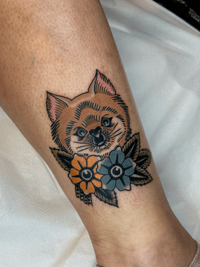 Get inked with a stunning traditional tattoo featuring a bat and flower motif by the talented artist Jakob Isaac.