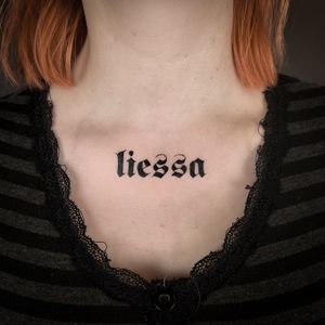 Stunning lettering tattoo by Jenny Dubet featuring the name 'Liessa' and an inspiring quote.