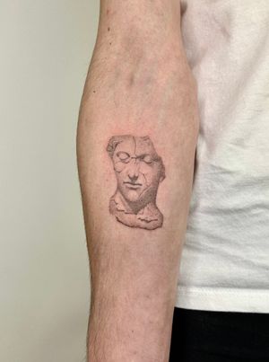Unique dotwork design by Alina Wiltshire brings a lifelike statue to life on your skin with delicate hand-poked technique.