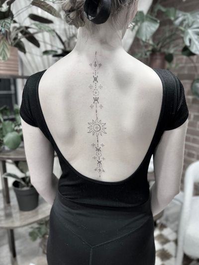 Elegant and intricate fine line ornamental tattoo design with delicate patterns, created by talented artist Aleks Fanta.