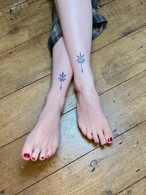 Elegant and intricate ornamental tattoo design created by the talented artist Charlotte Pokes. This delicate and dainty motif is perfect for those looking for a unique and beautiful tattoo.