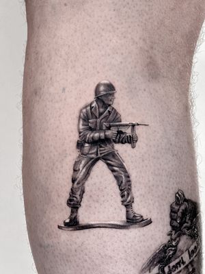 Capture childhood memories with this detailed black and gray micro-realism tattoo by Carolina Feodorov.