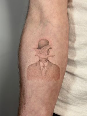 Hand-poked tattoo of man in bowler hat, inspired by the surrealist artist, Alina Wiltshire's unique style.