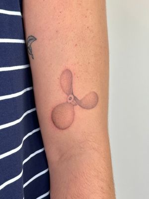Elegant propeller design created by Alina Wiltshire using intricate dotwork and handpoke techniques.