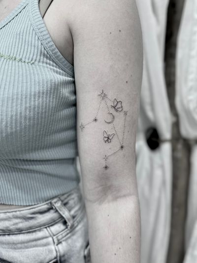 Elegant dotwork and fine line design featuring a moon, star, constellation, and butterfly motif. Perfect for celestial lovers.
