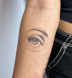 Experience Alina Wiltshire's unique dotwork and micro-realism style in this mesmerizing eye tattoo design.