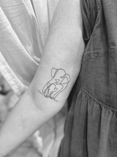 Get inked with a delicate single-line elephant design by Aleks Fanta. Perfect for those who appreciate simplicity in their body art.