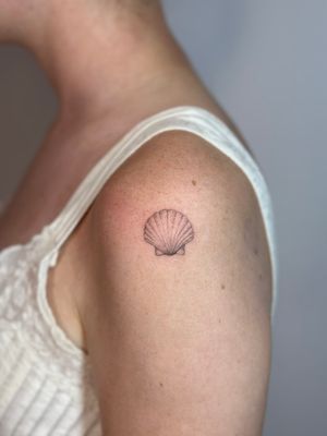 Experience the intricacy of Alina Wiltshire's shell design, beautifully crafted in dotwork style using hand-poke technique.