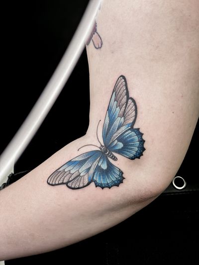 Get inked with a stunning illustrative butterfly design by the talented artist Carolina Feodorov. Embrace the beauty of nature with this elegant tattoo.