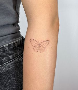 Unique butterfly tattoo done with intricate dotwork for a stunning hand-poked design by Alina Wiltshire.