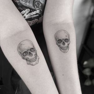 Experience a unique blend of dotwork and illustrative style in this striking skull tattoo, expertly created by tattoo artist Oliver Whiting.