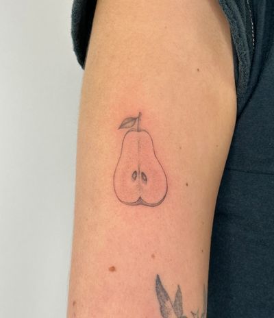Get a unique and artistic pear tattoo with intricate dotwork design hand-poked by talented artist Alina Wiltshire.