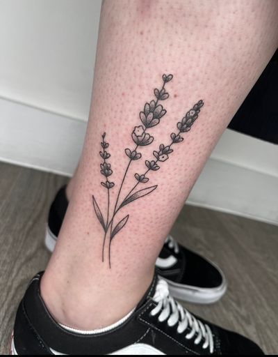 Beautiful hand-poked flower tattoo by Marketa.handpoke, combining dotwork and fine line techniques for a unique and delicate look.