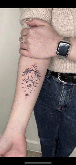A stunning fine line ornamental tattoo created by Marketa.handpoke, showcasing delicate and intricate designs.