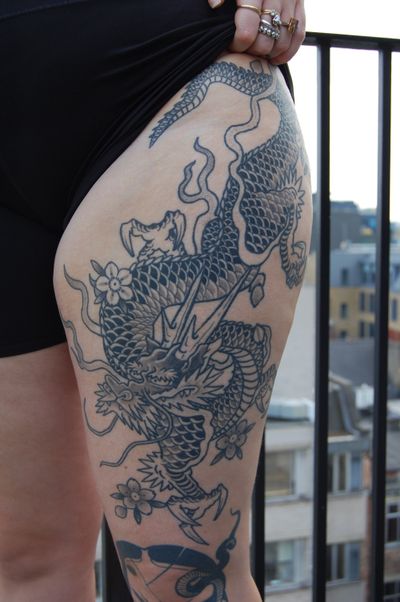 Experience the power and beauty of a traditional Japanese dragon tattoo by acclaimed artist Bananajims.