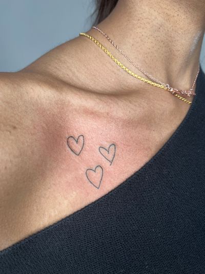 Get a delicate and minimalistic heart tattoo done by the talented Marketa.handpoke. Perfect for a subtle yet meaningful piece.
