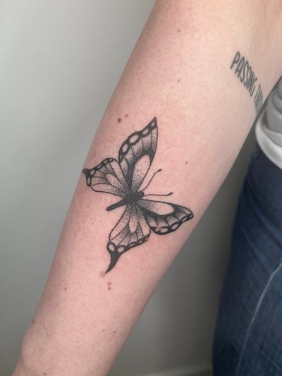 Discover the beauty of dotwork in this unique butterfly design by Marketa.handpoke. Hand-poked with precision for a delicate and organic look.