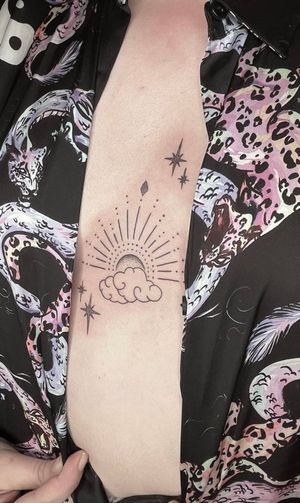 Experience the artistry of Marketa.handpoke in this detailed and elegant design combining dotwork and ornamental elements.
