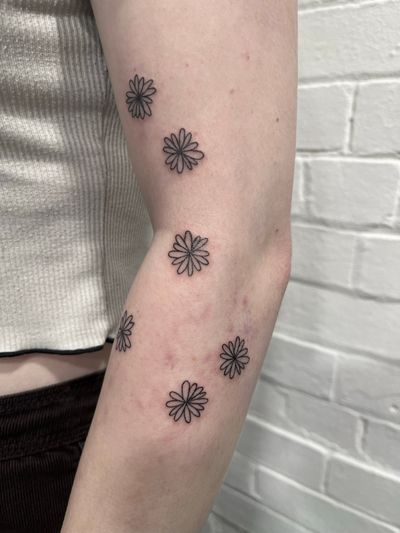 Experience the unique beauty of dotwork hand-poke technique by Marketa.handpoke, featuring a stunning flower patchwork design.