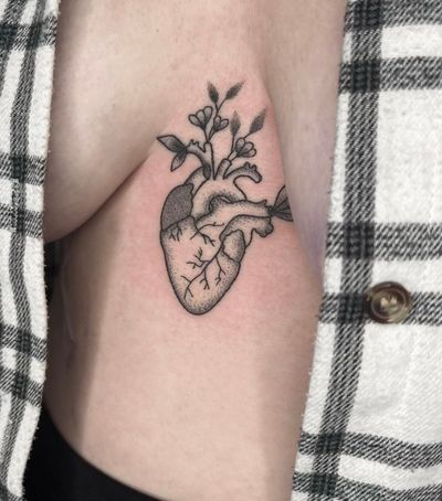 Express your love with this intricately designed dotwork heart tattoo done by the talented artist Marketa.handpoke.