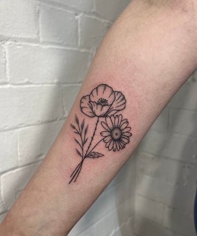 Exquisite hand-poked tattoo by Marketa.handpoke, featuring a delicate flower design in dotwork style.